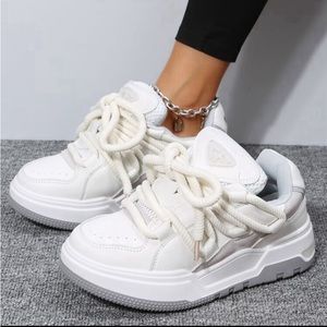 Woman’s grey and white chunky sneakers